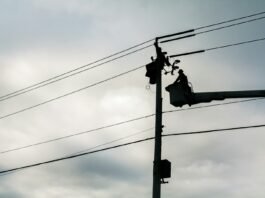silhouette of street lamp during daytime