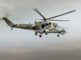 low angle photography of brown and gray helicopter